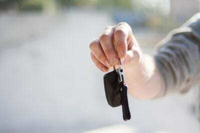 a person holding a black object