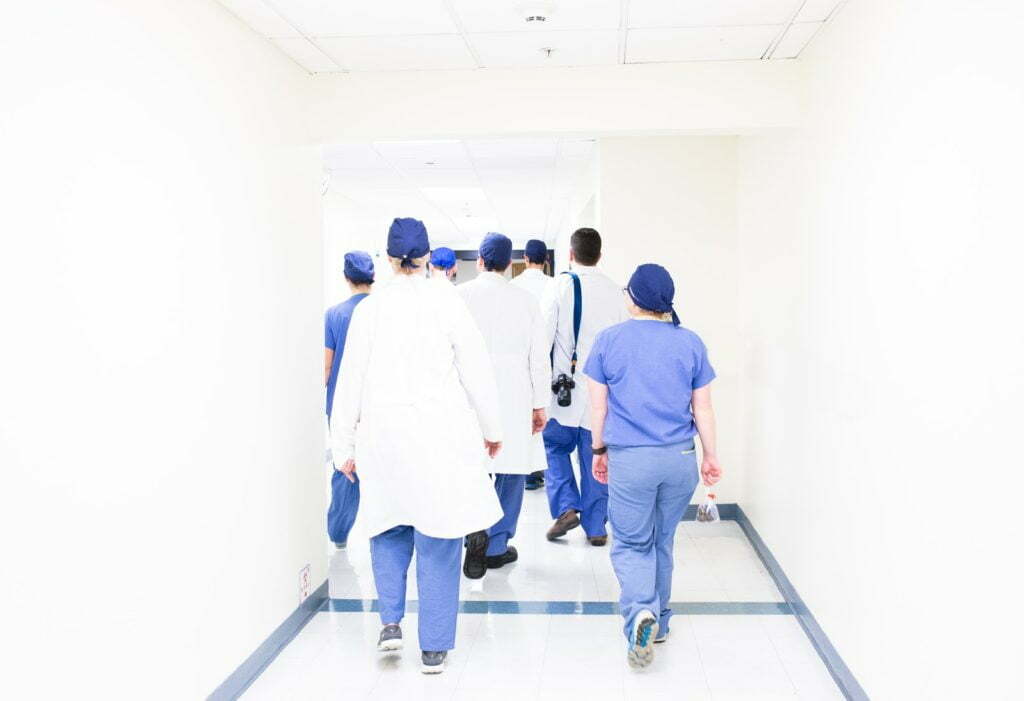 a group of people walking in a hallway