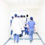 a group of people walking in a hallway