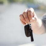 a person holding a black object