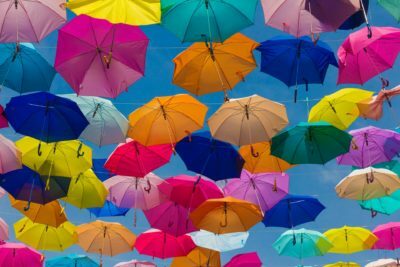 a group of umbrellas are in the air