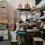 a person and a child in a warehouse