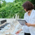 Organization of weddings, parties, catering for events. Female on the background banquet decorated