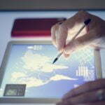 Hands holding using magic pen on tablet