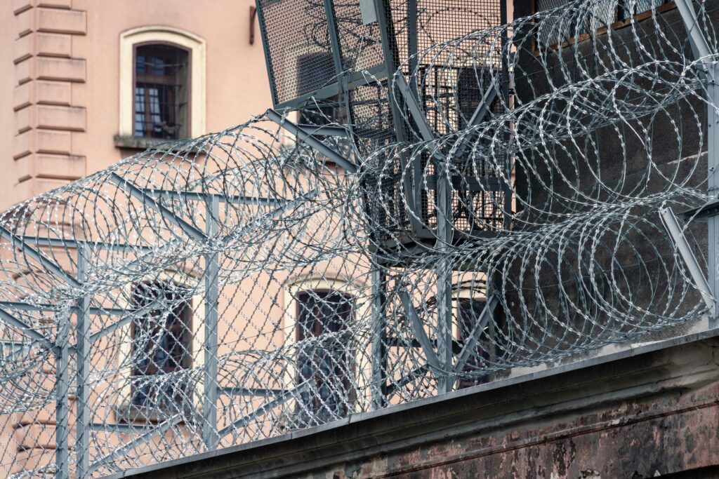 a metal fence with a metal gate