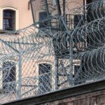 a metal fence with a metal gate