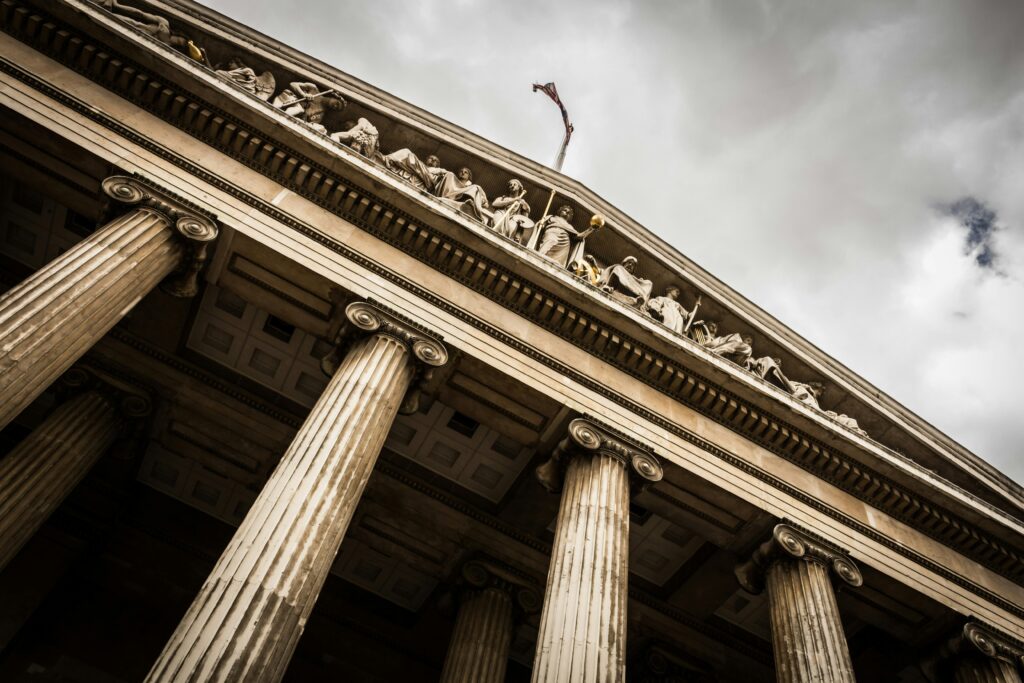 a building with columns and a flag