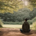 a person sitting in a peaceful park, surrounded by trees, practicing deep breathing exercises.